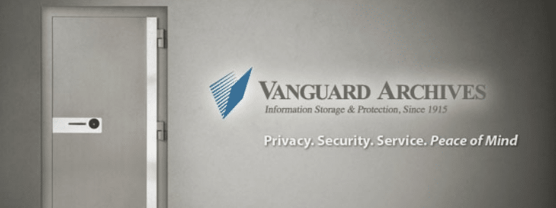the Vanguard Logo and Tagline that reads "Privacy. Security. Service. Peace of Mind" against a grey wall beside an open vault door.